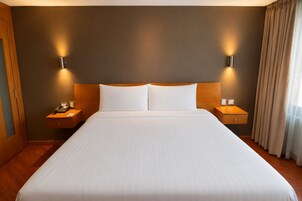 Premium bedding, down comforters, memory foam beds, minibar