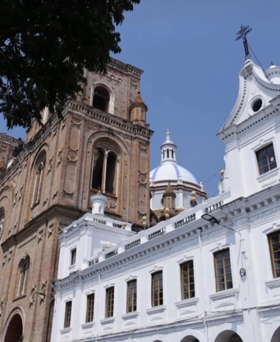A historic cathedral with classical architecture, featuring a prominent dome and detailed stonework.