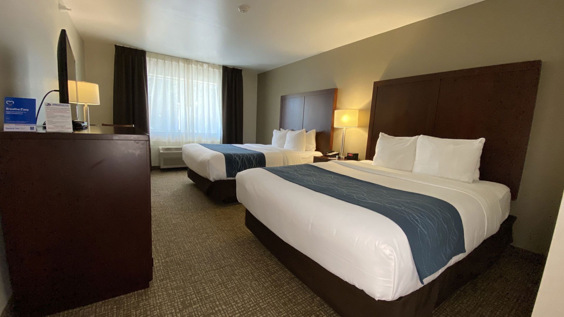 Pillowtop beds, desk, blackout drapes, iron/ironing board