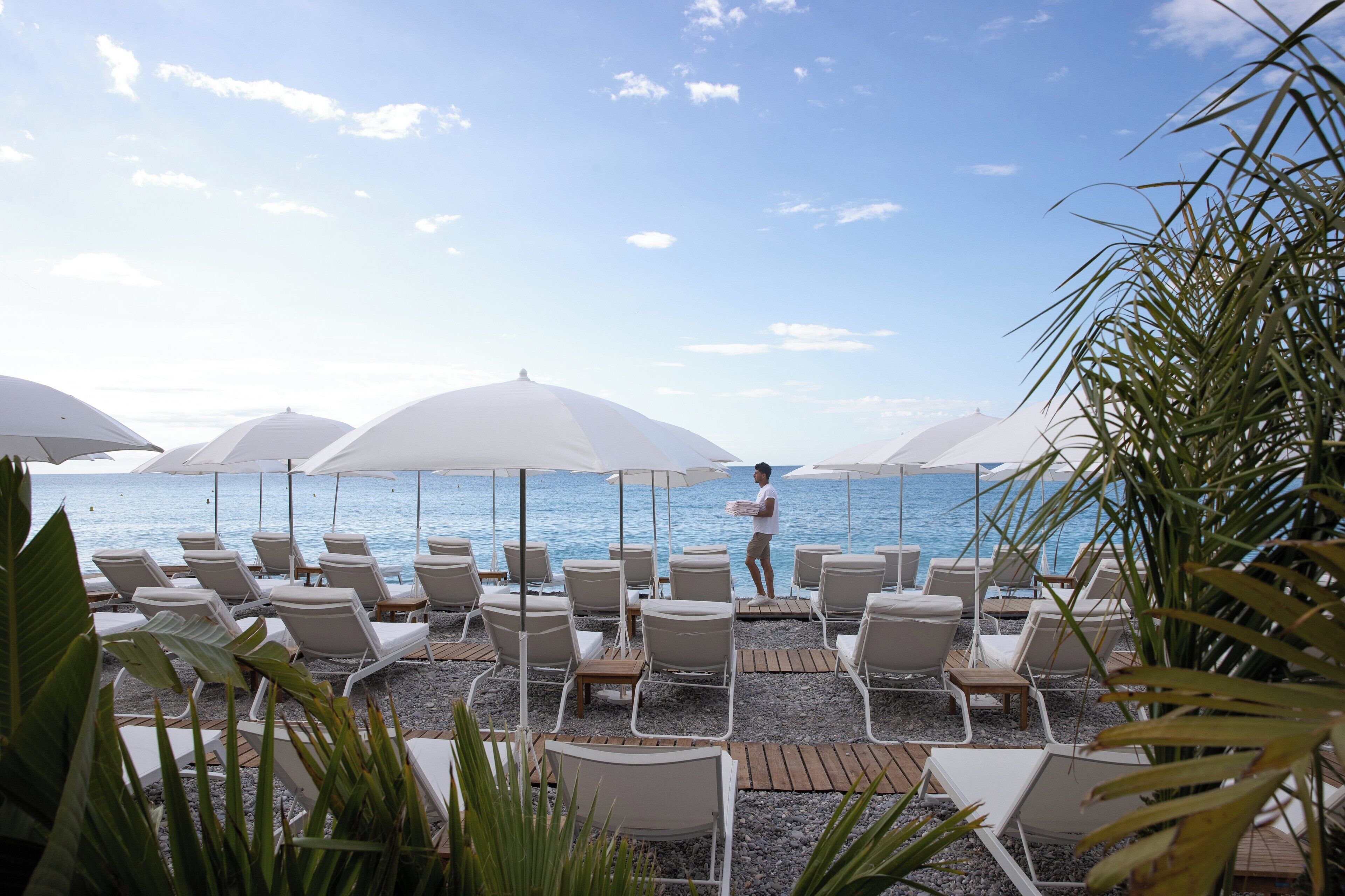 private beach, white sand, beach cabanas, sun-loungers