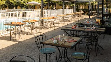 Lunch, dinner served; French cuisine, pool views