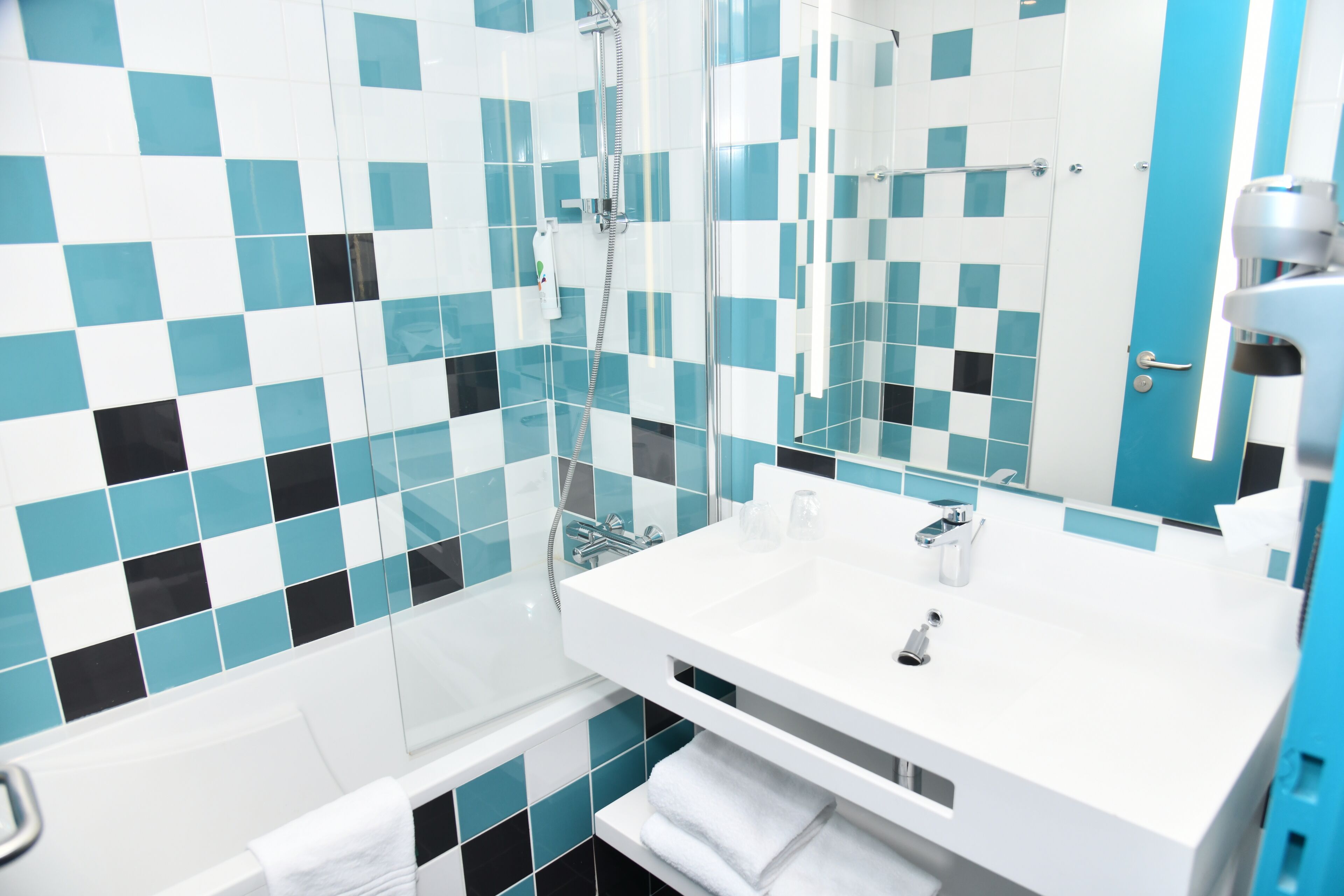 eco-friendly toiletries, hair dryer, towels