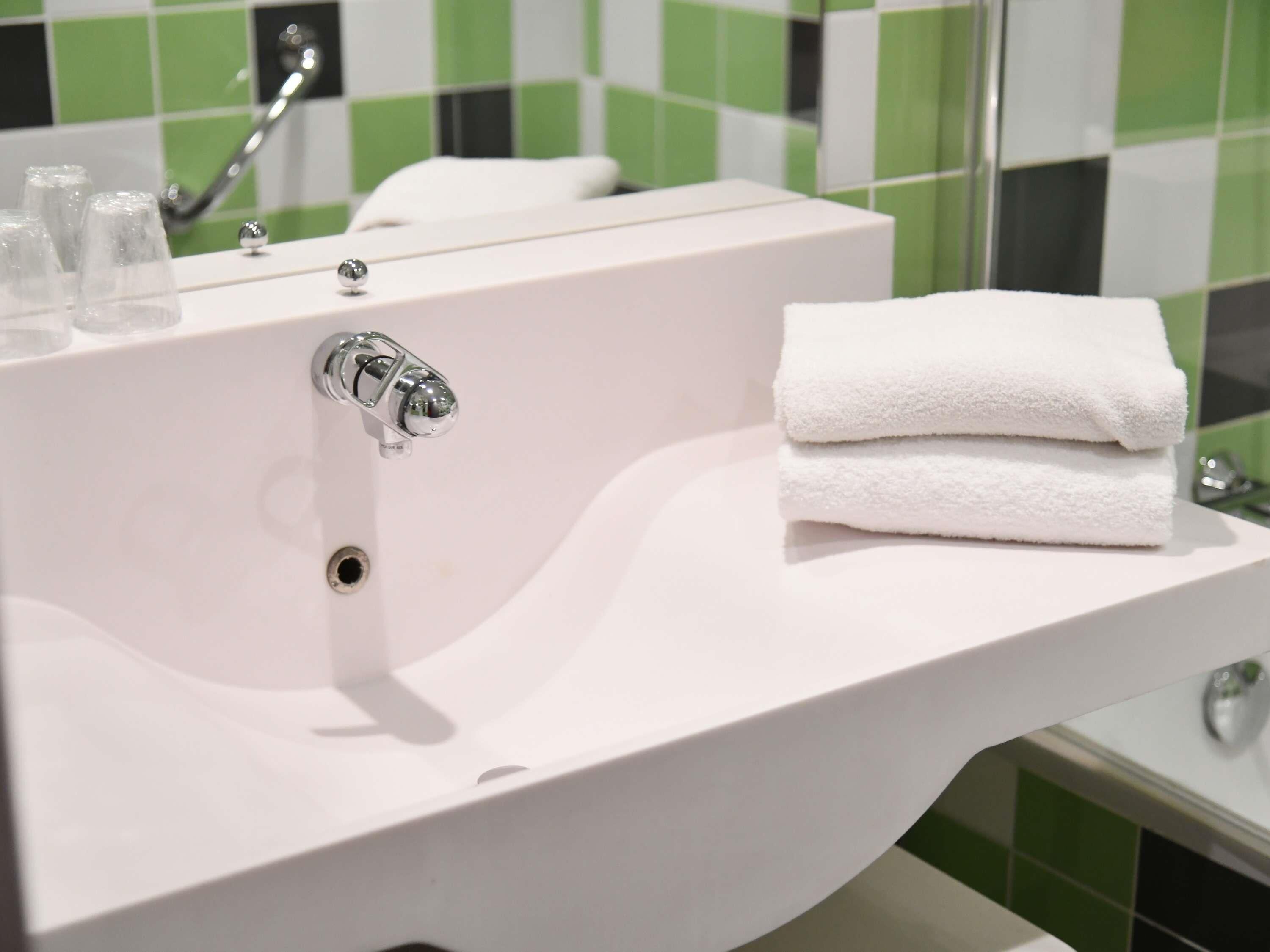 Eco-friendly toiletries, hair dryer, towels