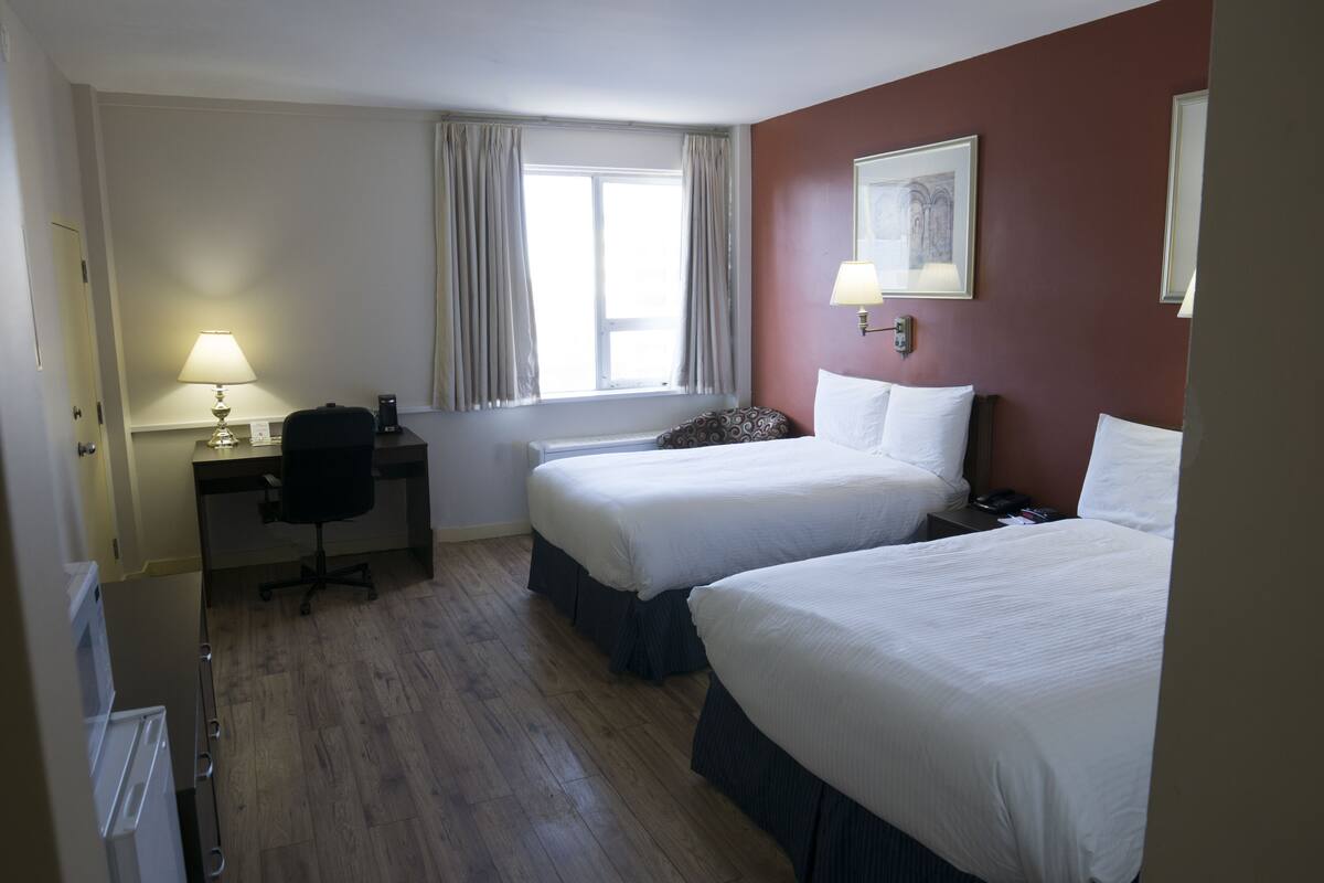 Deluxe Room, 2 Double Beds | Pillowtop beds, in-room safe, blackout drapes, iron/ironing board