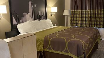 A hotel room with a bed, a cityscape artwork on the wall, a nightstand, two wall lamps, a window with curtains, and a tiled floor.