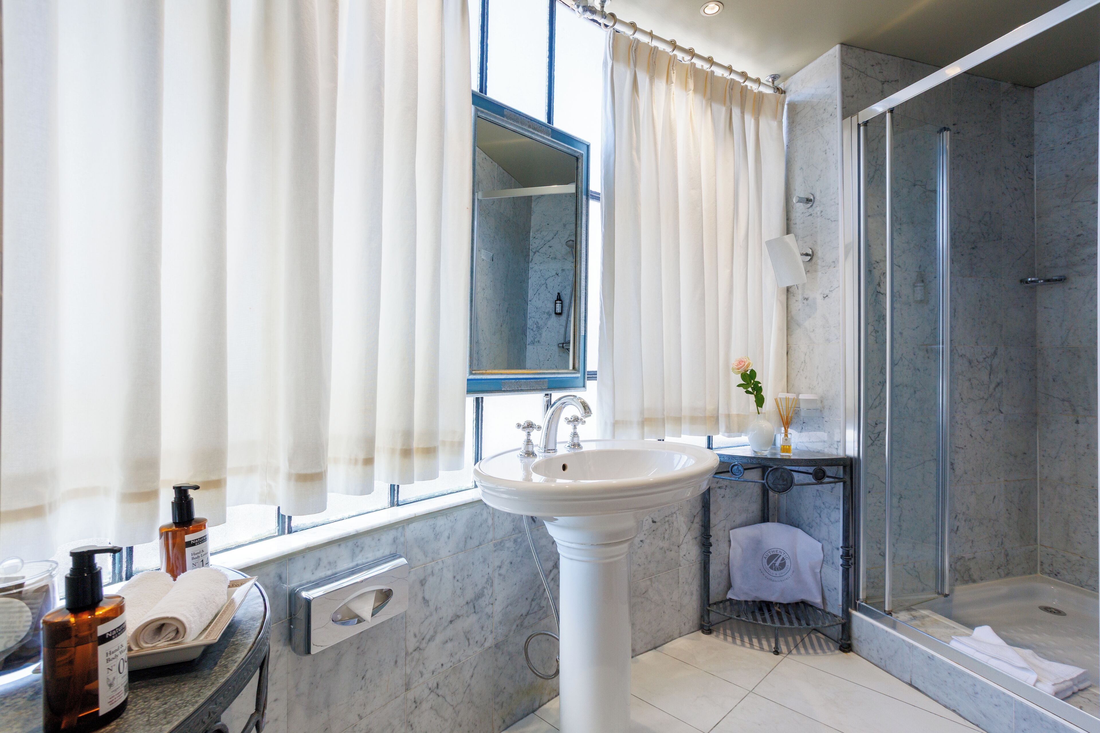 rotunda room (free wine tasting) | bathroom | designer toiletries, hair dryer, towels, soap