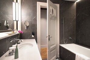 Designer toiletries, hair dryer, bathrobes, slippers
