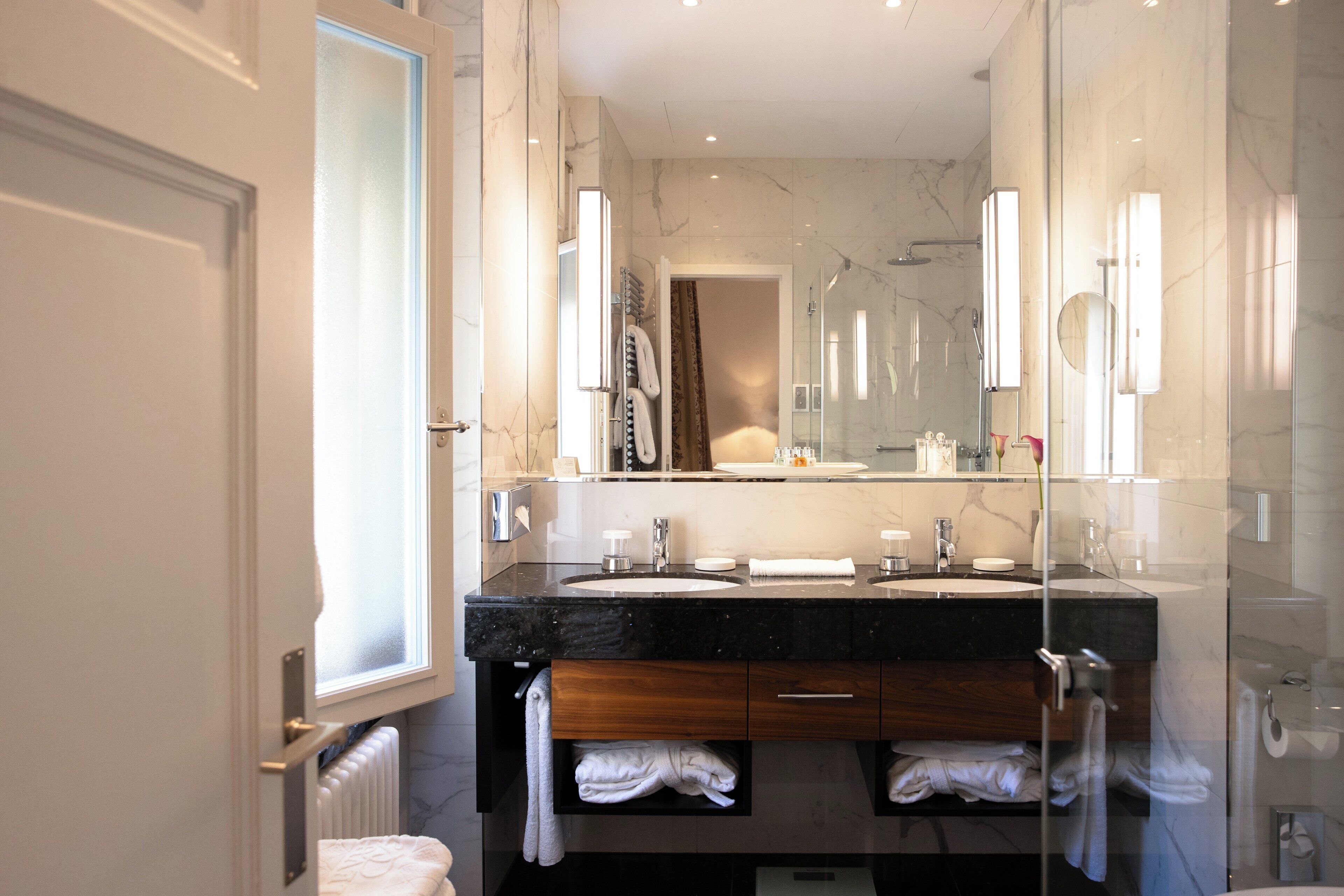 designer toiletries, hair dryer, bathrobes, slippers