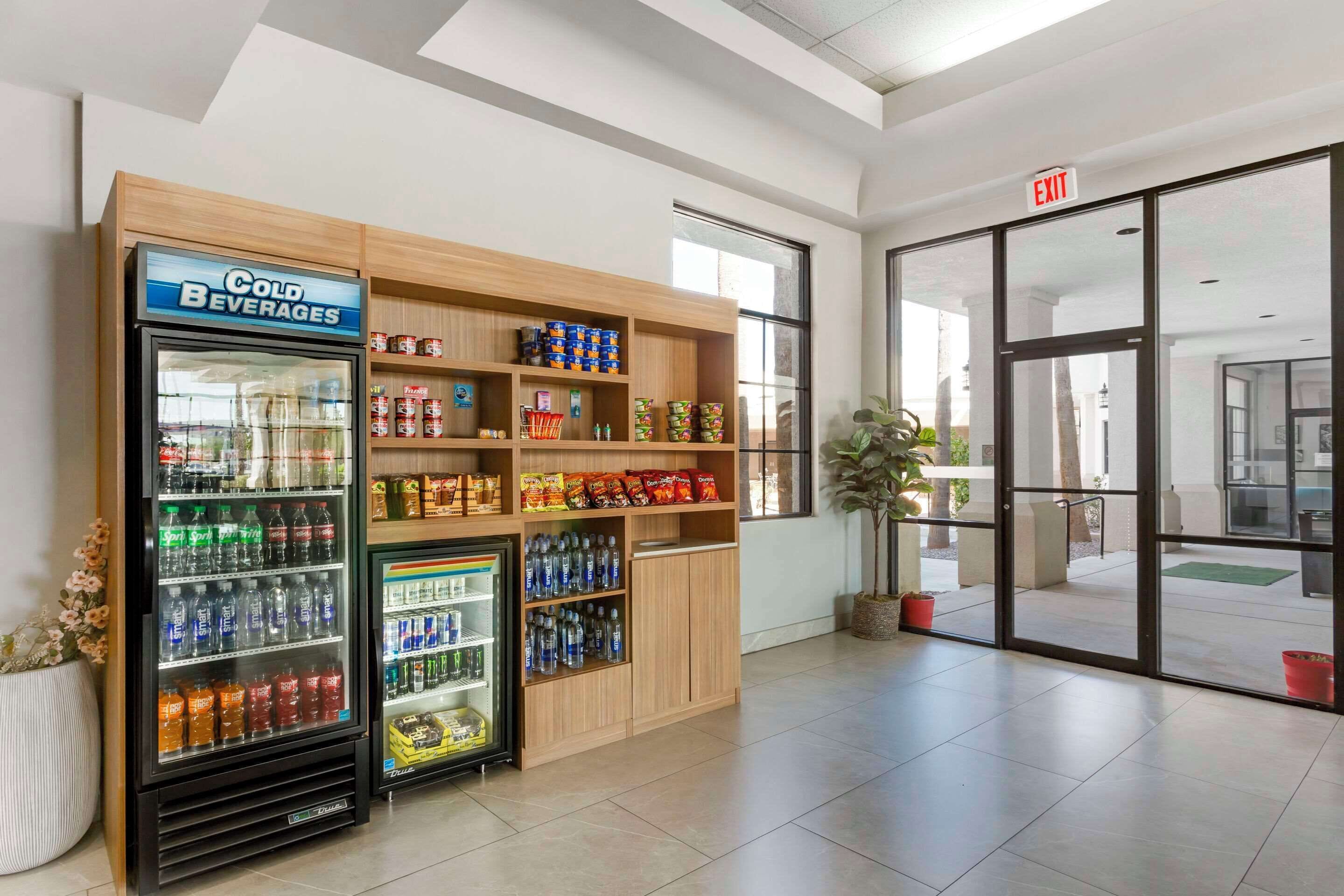 A vending area with a 'Cold Beverages' refrigerator and a snack shelf.