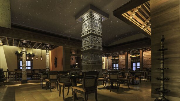 A spacious restaurant with high ceilings, starry ceiling design, and traditional decor. - President, Mumbai - IHCL SeleQtions (Mumbai)