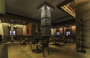 A spacious restaurant with high ceilings, starry ceiling design, and traditional decor. - President, Mumbai - IHCL SeleQtions (Mumbai)