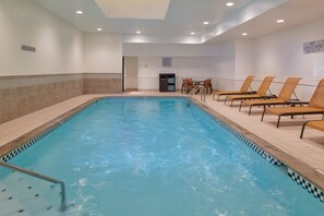 A swimming pool with lounge chairs and a 'No Diving' sign. - Courtyard by Marriott Detroit Livonia (Livonia)