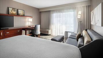 Hypo-allergenic bedding, desk, laptop workspace, blackout curtains