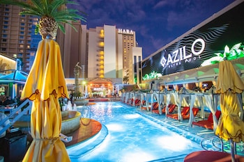 Seasonal outdoor pool, cabanas (surcharge), pool umbrellas at SAHARA Las Vegas