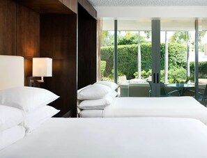 Premium bedding, in-room safe, blackout curtains, soundproofing