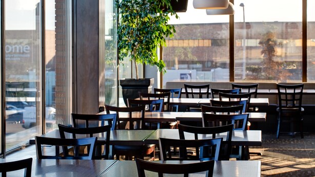 A restaurant with tables and chairs arranged for dining. - Best Western Plus City Centre Inn (Edmonton)