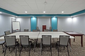 A conference room with a long table, six chairs, and a whiteboard. - Best Western Plus City Centre Inn (Edmonton)