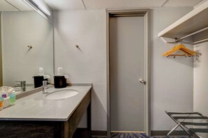 Desk, laptop workspace, blackout drapes, iron/ironing board