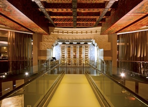 Experience the grandeur of our lobby, featuring a stunning staircase, intricate ceiling patterns, and beautifully crafted carvings.