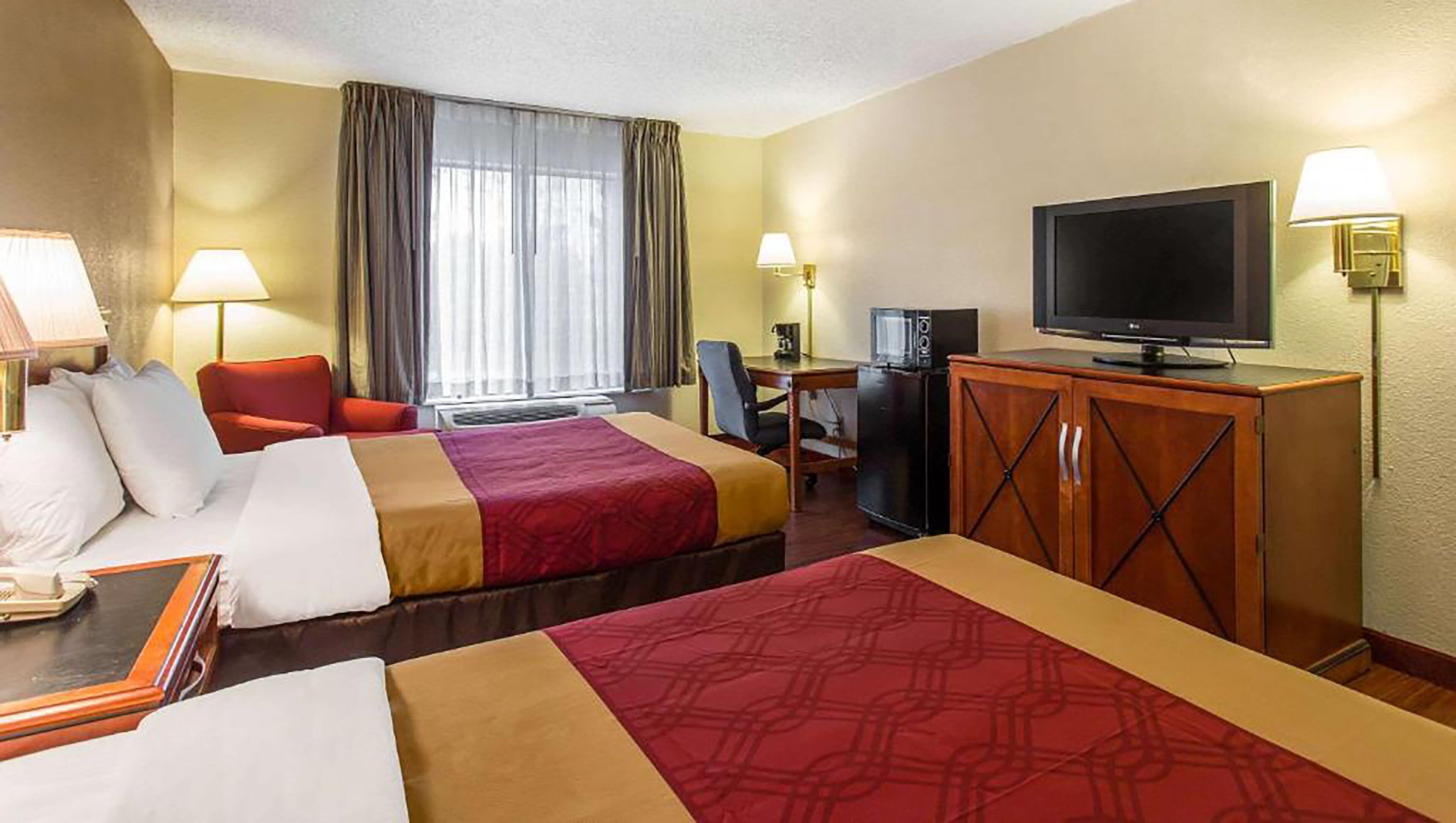 hypo-allergenic bedding, desk, laptop workspace, blackout curtains