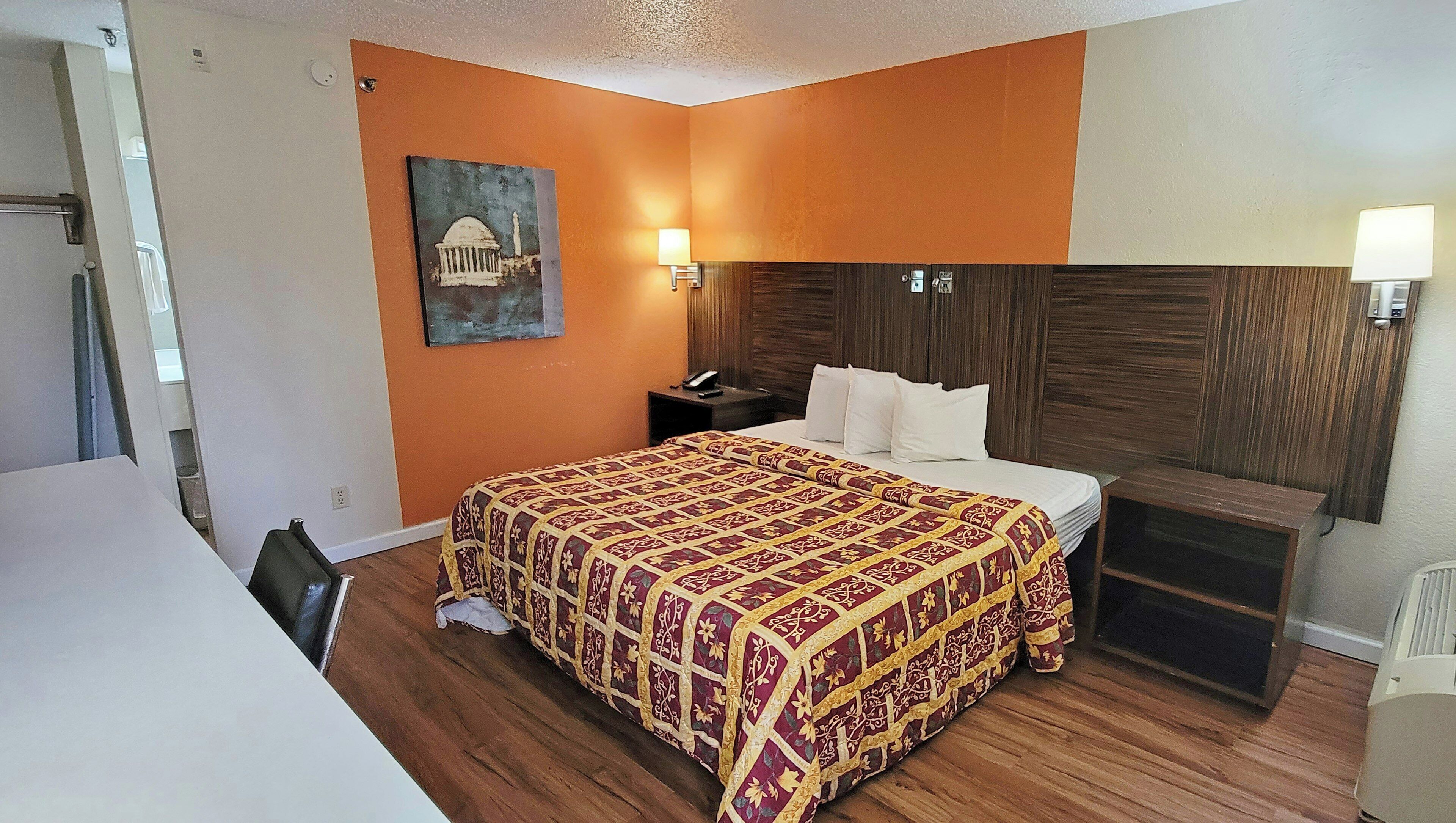 Hypo-allergenic bedding, desk, laptop workspace, blackout curtains