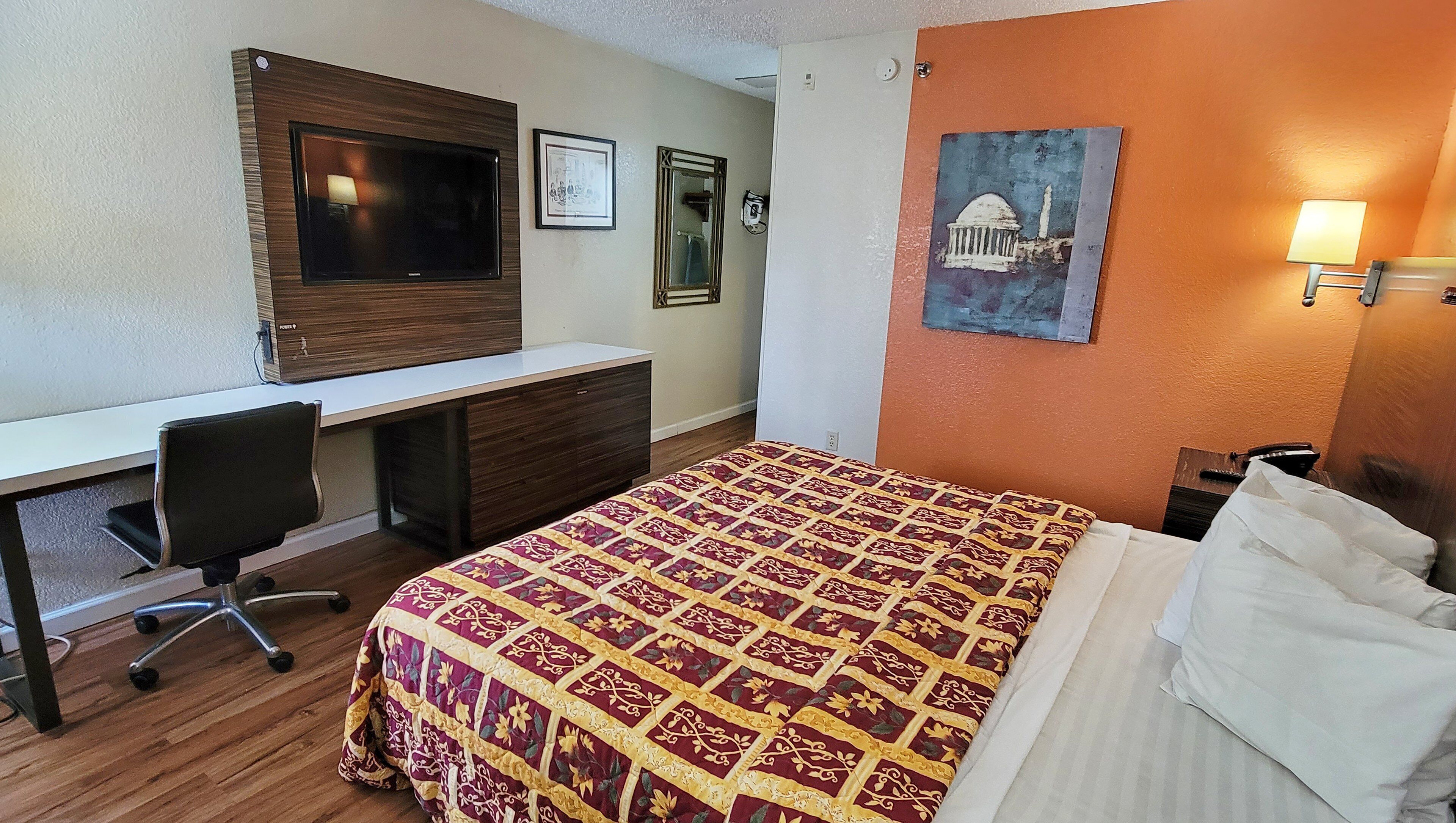 hypo-allergenic bedding, desk, laptop workspace, blackout curtains