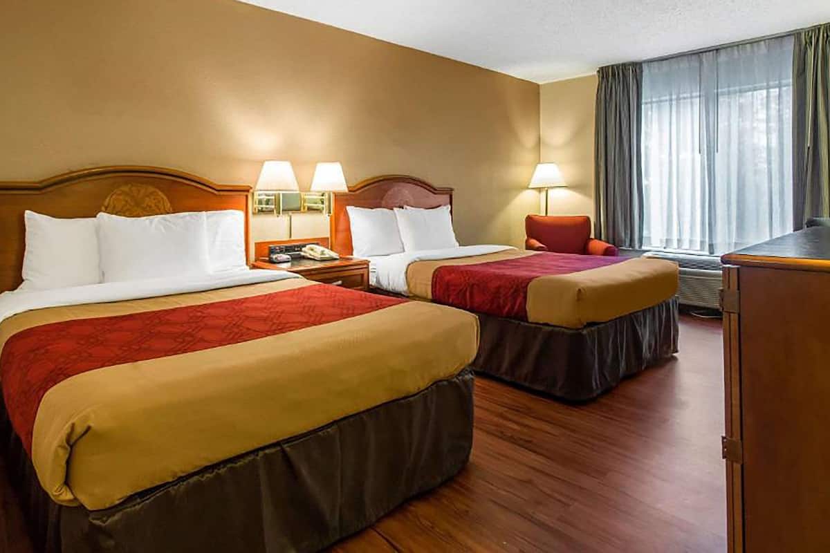 hypo-allergenic bedding, desk, laptop workspace, blackout curtains