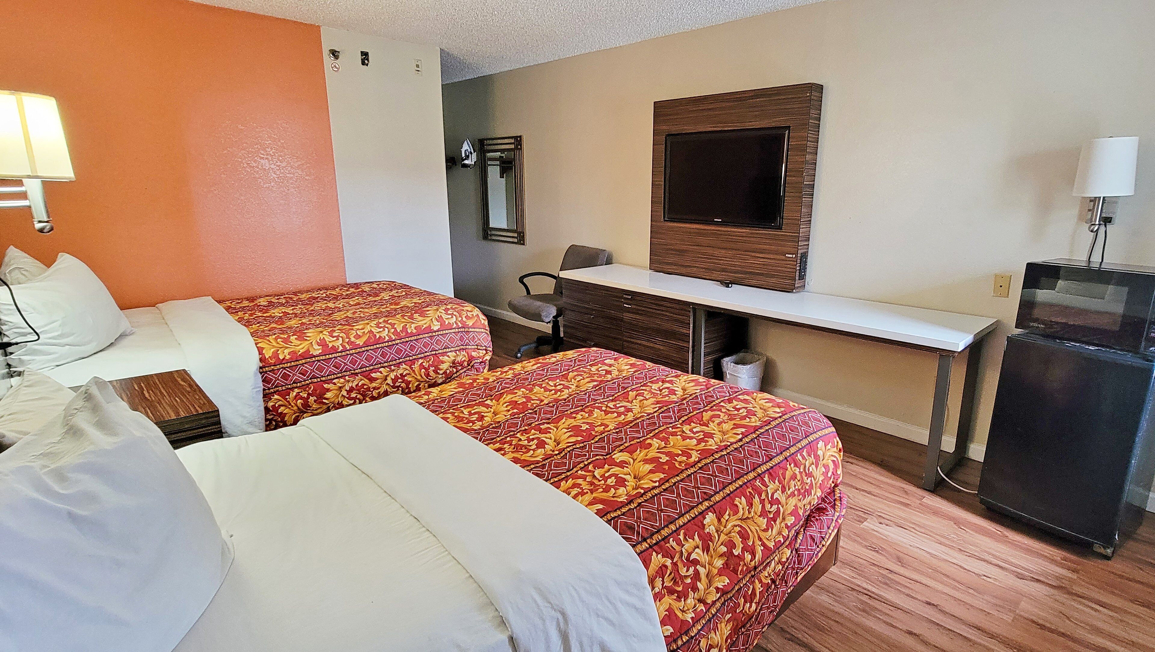 hypo-allergenic bedding, desk, laptop workspace, blackout curtains