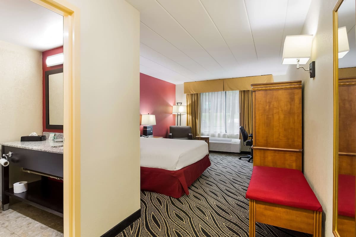 Suite, 1 Queen Bed, Refrigerator & Microwave, Poolside (with Sofabed) | Desk, laptop workspace, iron/ironing board, free cots/infant beds
