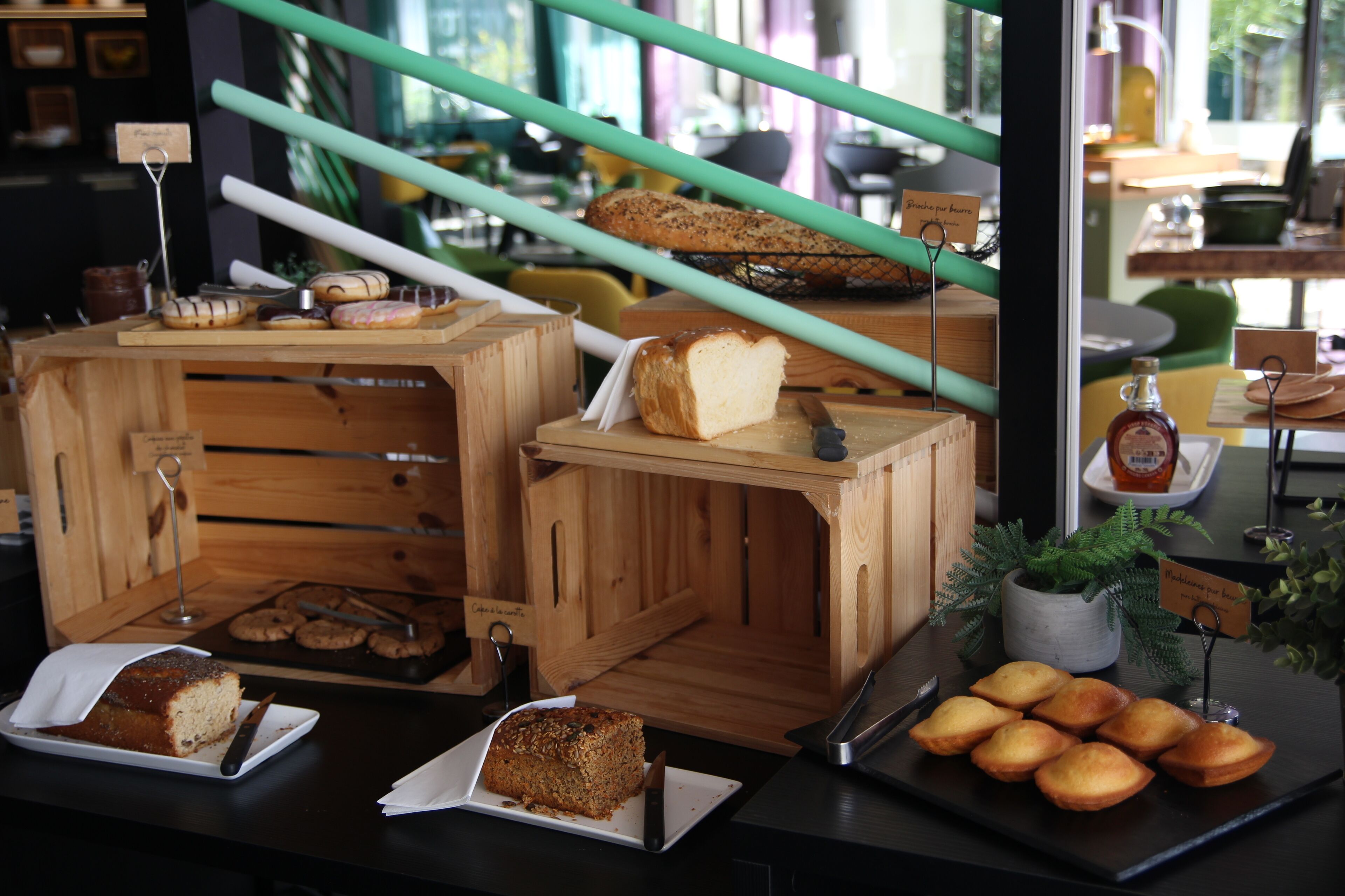 A bakery display with various baked goods and a knife on a counter.