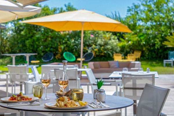 Breakfast, lunch, dinner served; Mediterranean cuisine, pool views