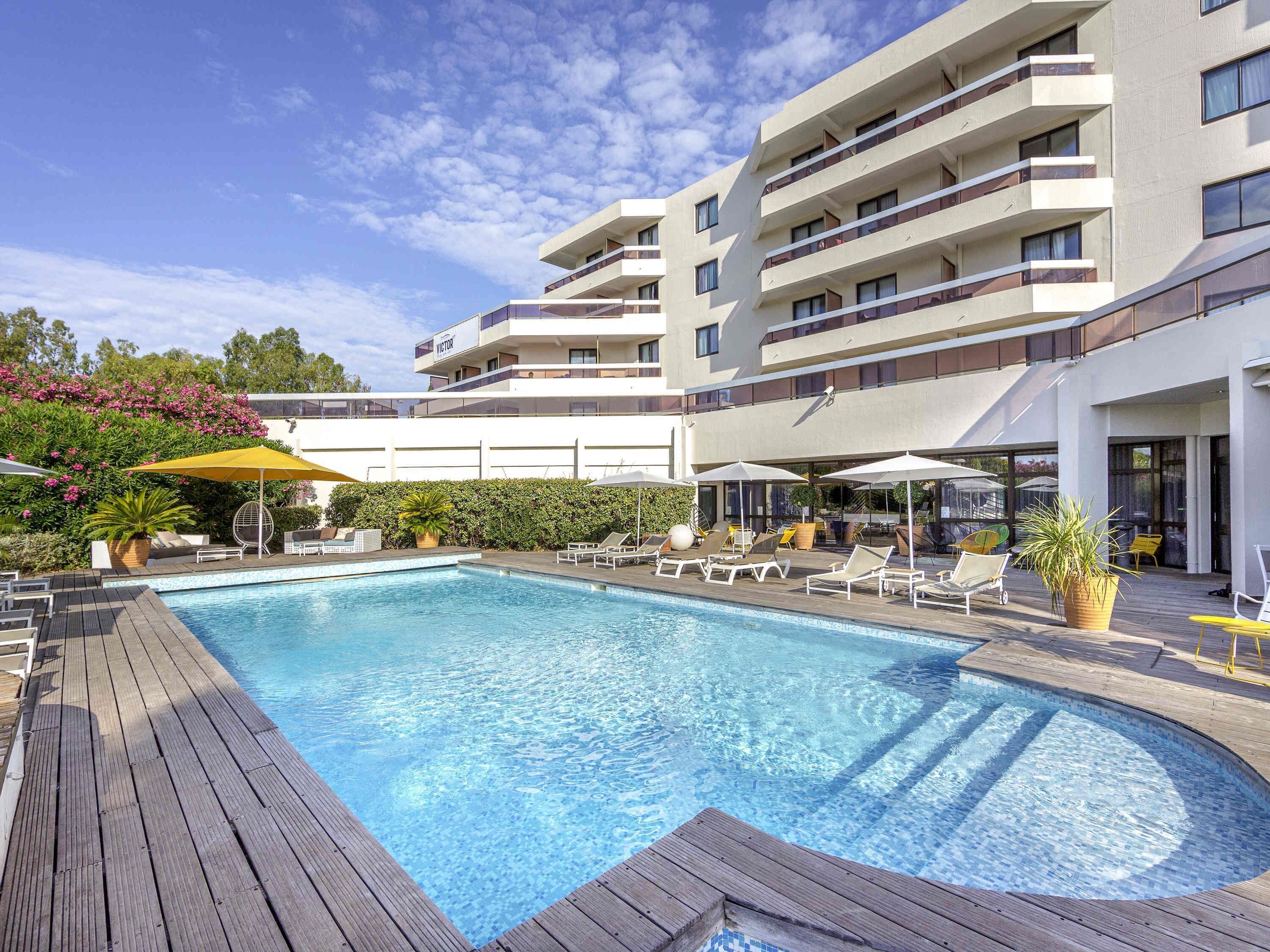 Seasonal outdoor pool, open 8:00 AM to 9:00 PM, pool umbrellas