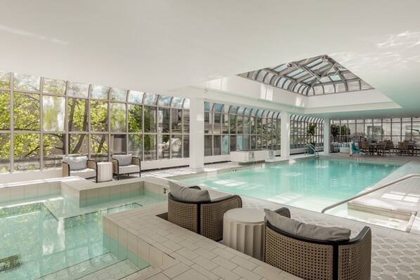 Relax by the pool surrounded by comfortable seating and natural views.