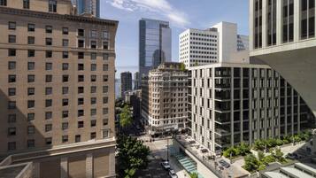 A high-rise urban building with multiple floors, large windows, and a modern architectural style.