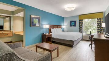 Desk, laptop workspace, blackout drapes, iron/ironing board