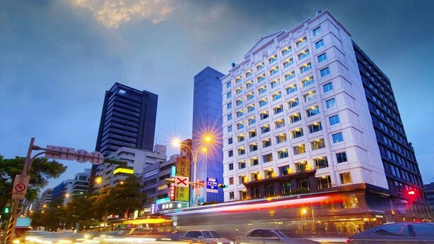 A high-rise hotel with multiple floors, large windows, and a modern architectural design. - Golden China Hotel (Taipei)
