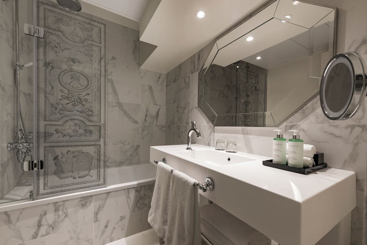 combined shower/bathtub, eco-friendly toiletries, hair dryer, bathrobes