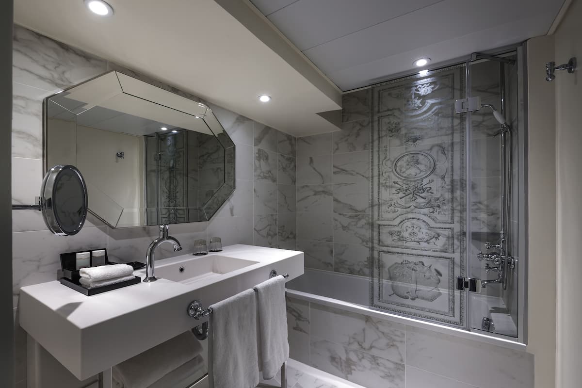 combined shower/bathtub, eco-friendly toiletries, hair dryer, bathrobes