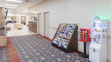 Welcome to our lobby, where a traditional patterned carpet and modern reception desk set the tone for a comfortable stay.