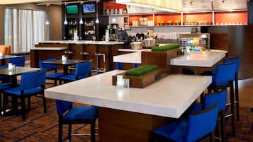 Relax and socialize in our stylish bar area, offering a variety of seating options and a well-stocked bar with a menu board.