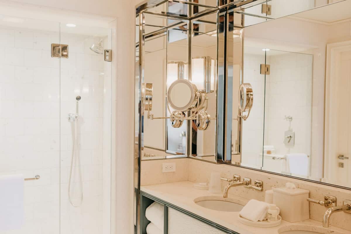 combined shower/bathtub, designer toiletries, hair dryer, bathrobes