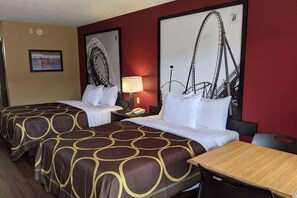 A hotel room with two beds, a wooden table, and a wall with a roller coaster picture. - Super 8 by Wyndham Sandusky (Sandusky)