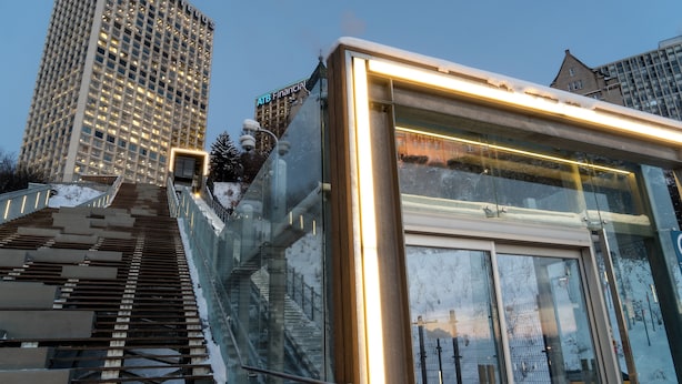 A modern building with a glass facade and a staircase leading to an entrance. - The Westin Edmonton (Edmonton)