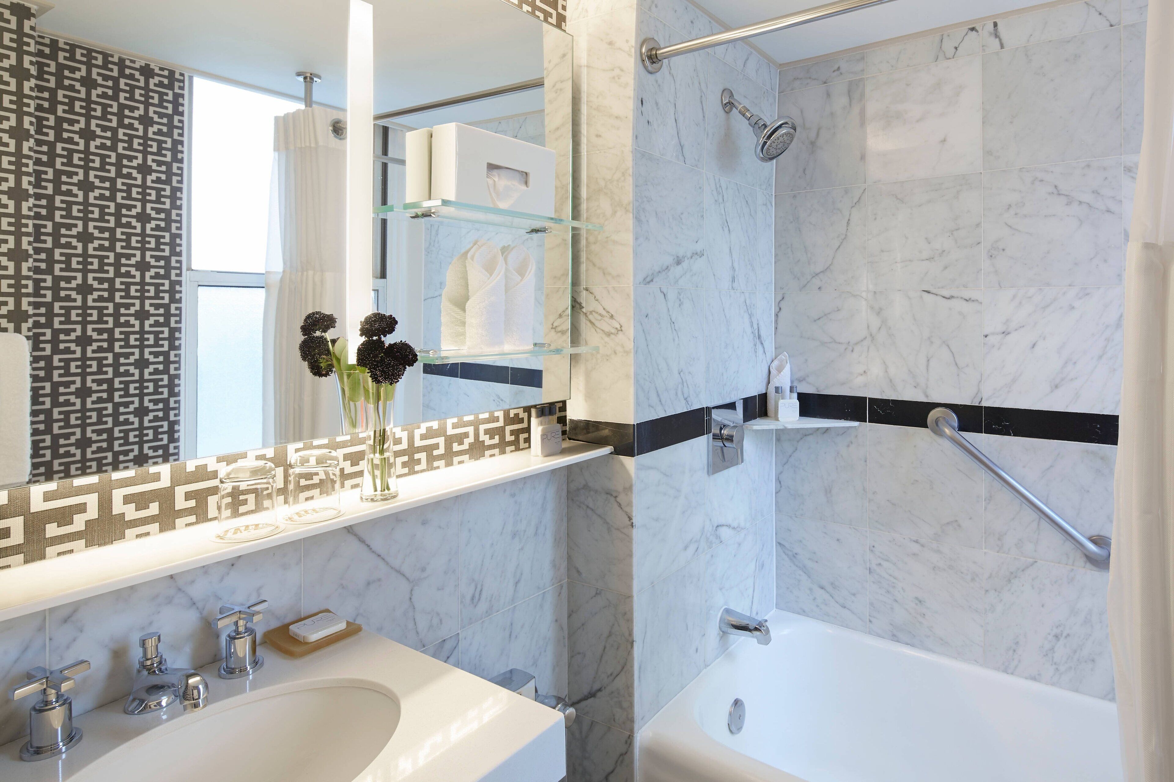 combined shower/bathtub, free toiletries, hair dryer, towels