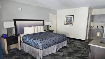 Habitación Deluxe, 1 cama King size, para no fumadores | Escritorio, cortinas blackout y tabla de planchar con plancha