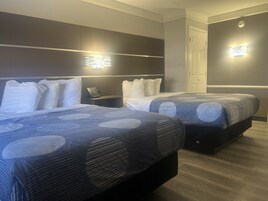 Pillowtop beds, desk, blackout drapes, iron/ironing board