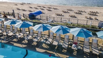 Indoor pool, seasonal outdoor pool, pool umbrellas, pool loungers