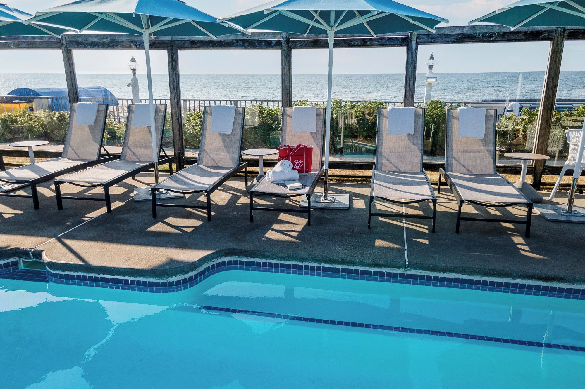 indoor pool, seasonal outdoor pool, pool umbrellas, pool loungers