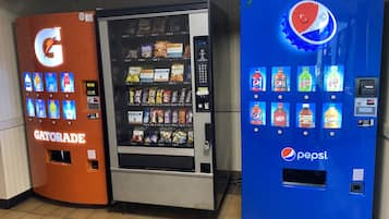 Three beverage vending machines: Gatorade, a neutral-colored machine, and a Pepsi machine.