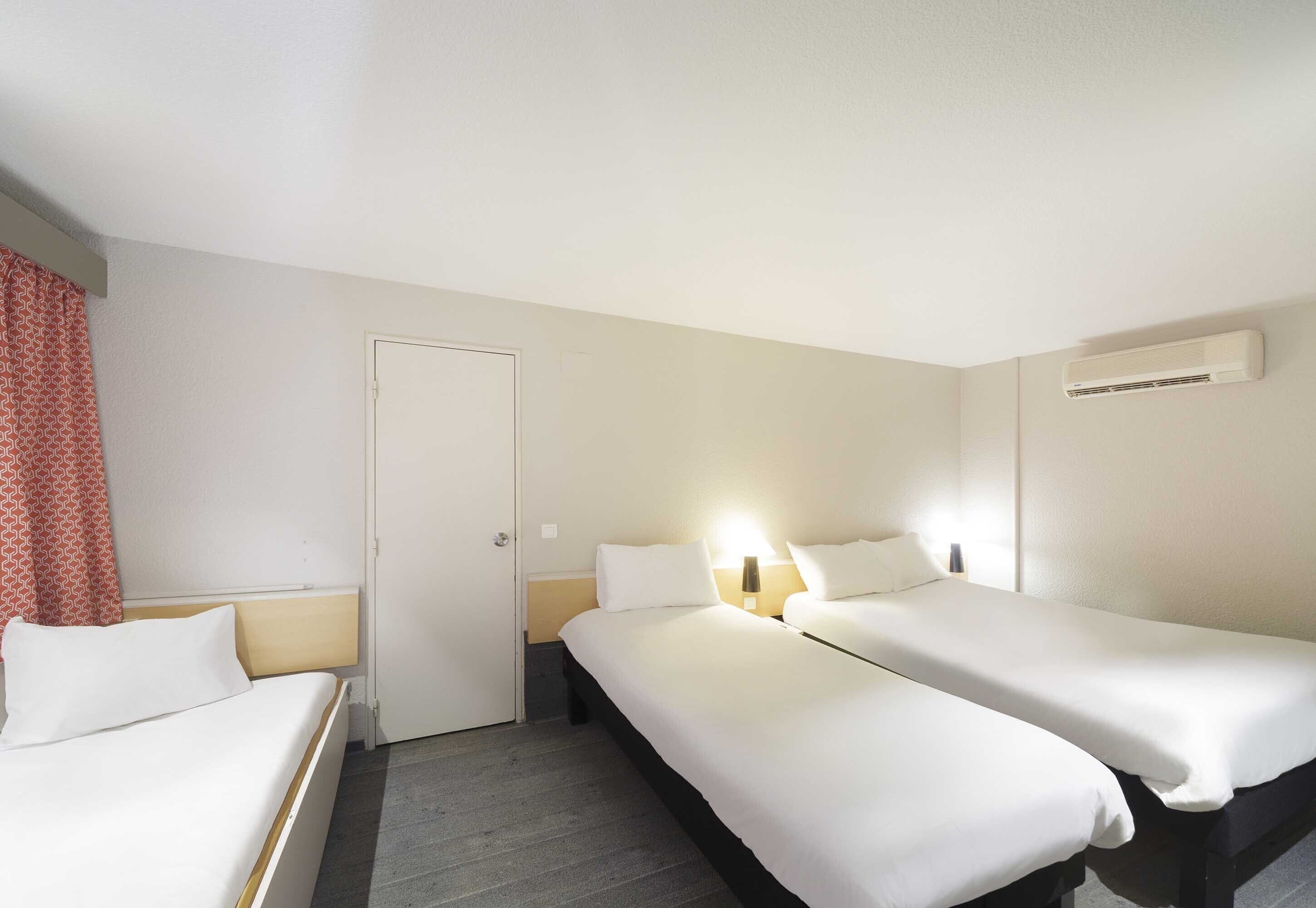 standard triple room, non smoking | premium bedding, desk, laptop workspace, blackout curtains